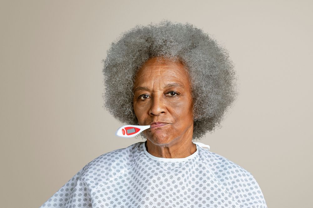 Senior patient checking her temperature