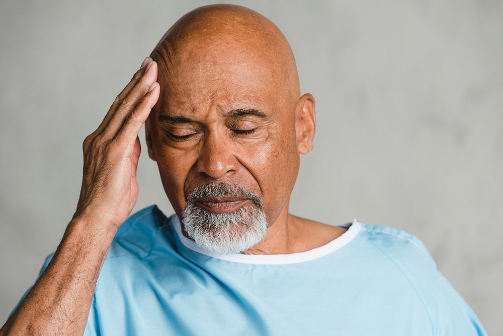 Senior patient having a headache