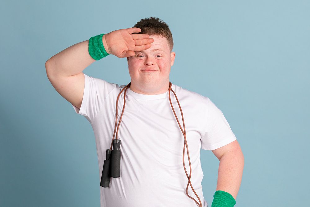 Kid with down syndrome with a skipping rope around his neck 