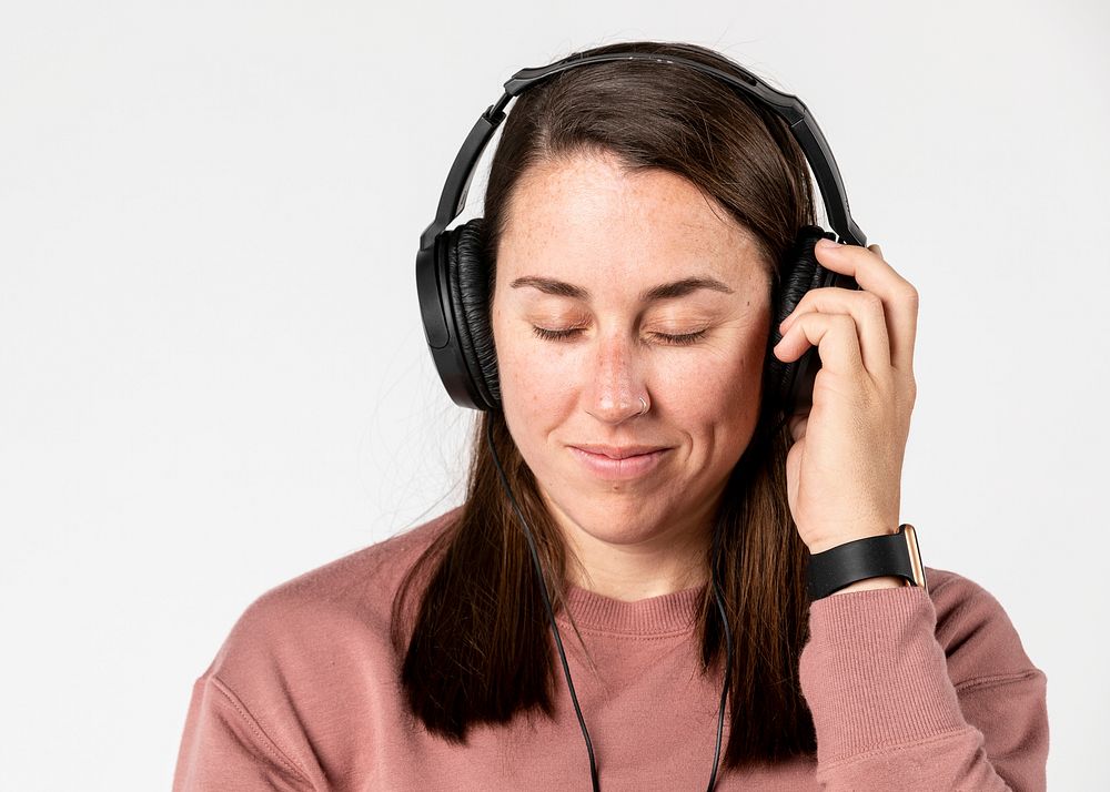 Brunette woman listening to music