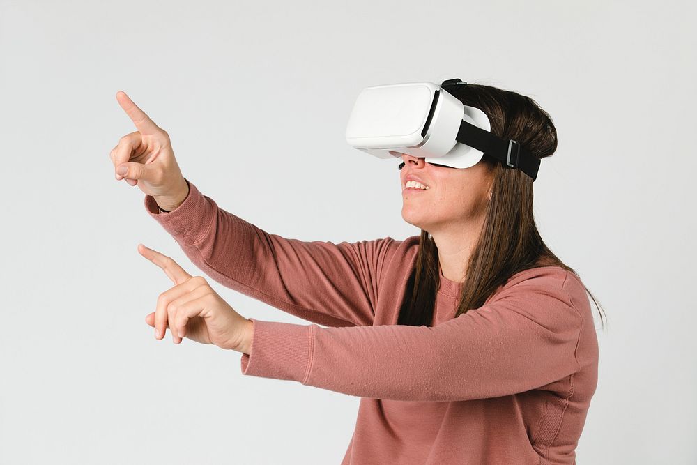 Cool girl on a wheelchair experiencing a VR headset