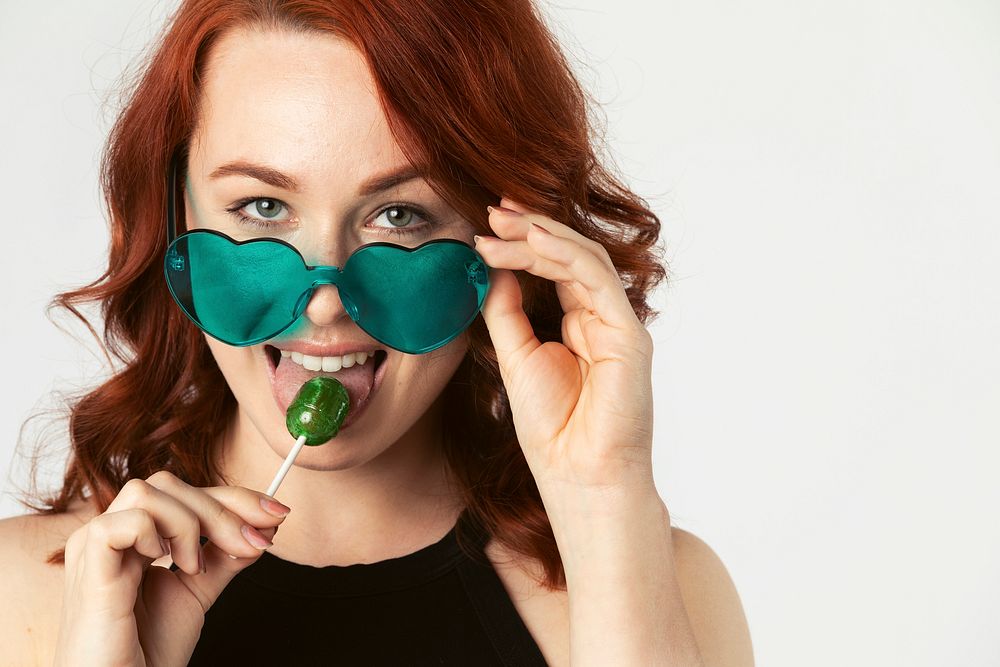 Beautiful woman enjoying a lollipop