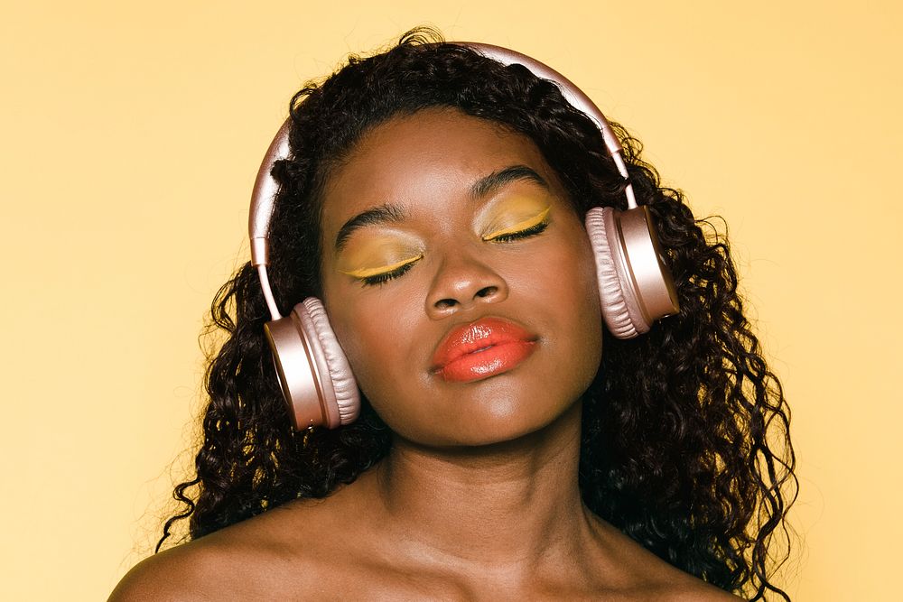 Woman listening to music through her headphones