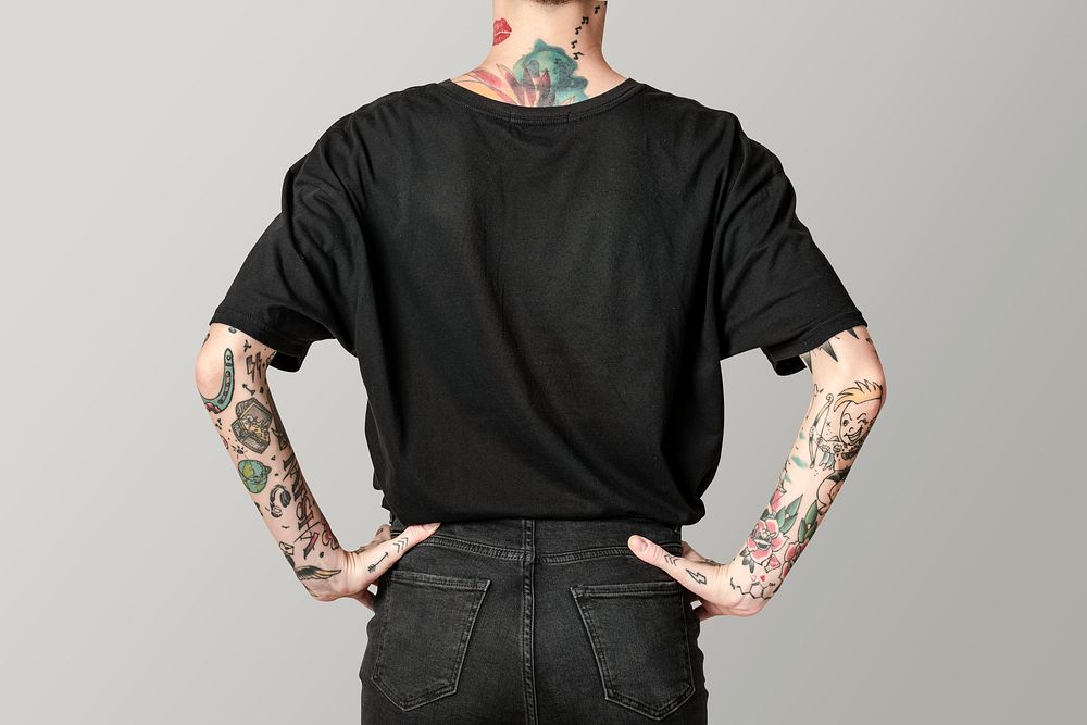 Tattooed model in black t shirt and jeans mockup