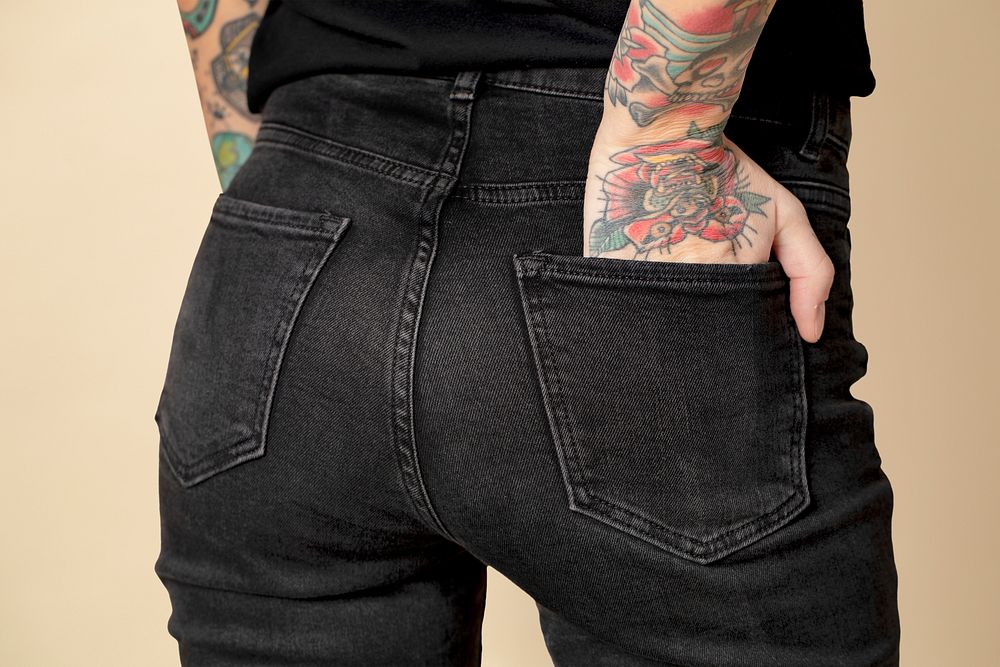 Model with tattoo in black T shirt and jeans mockup