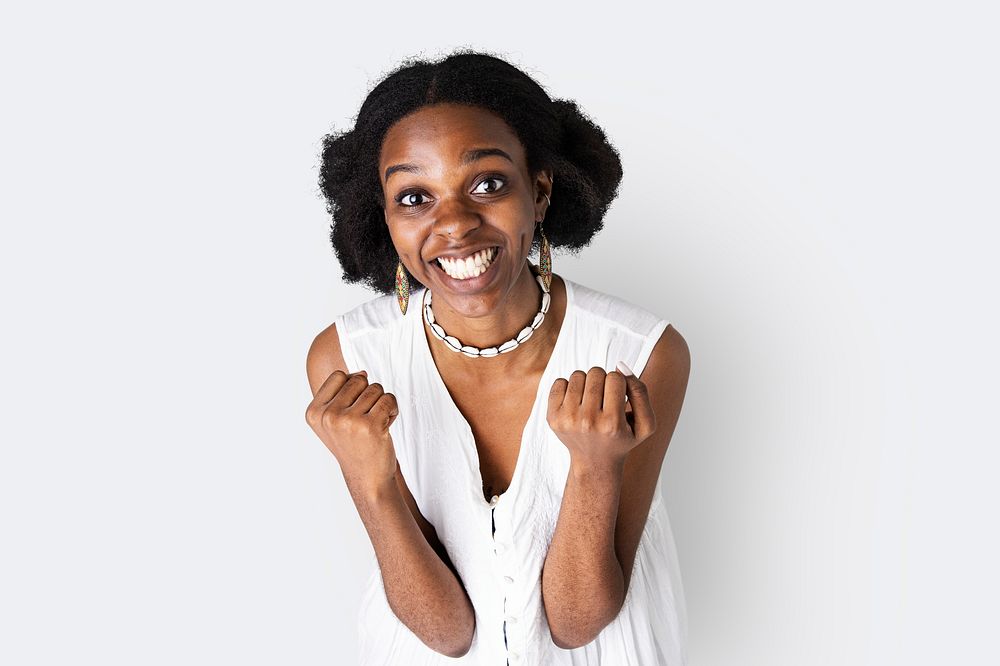Happy African American woman doing a successful hand gesture