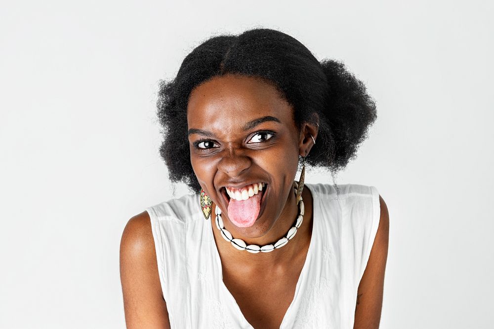 Cute playful African America woman sticking her tongue out