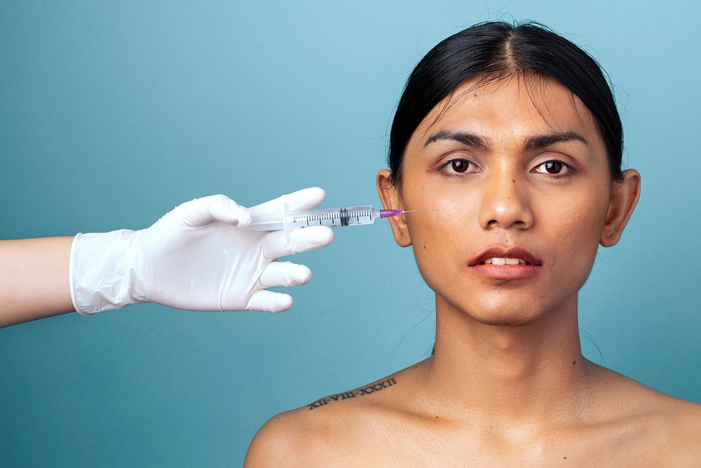 Beautiful woman gets a botox injection on her face