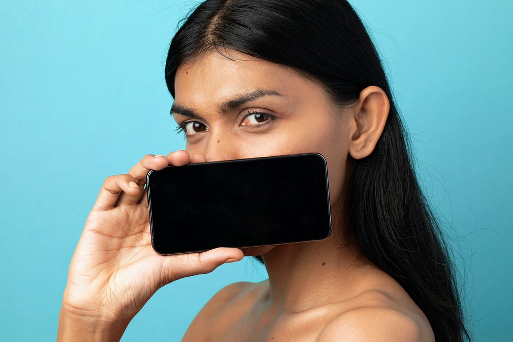 Woman showing a mobile screen mockup