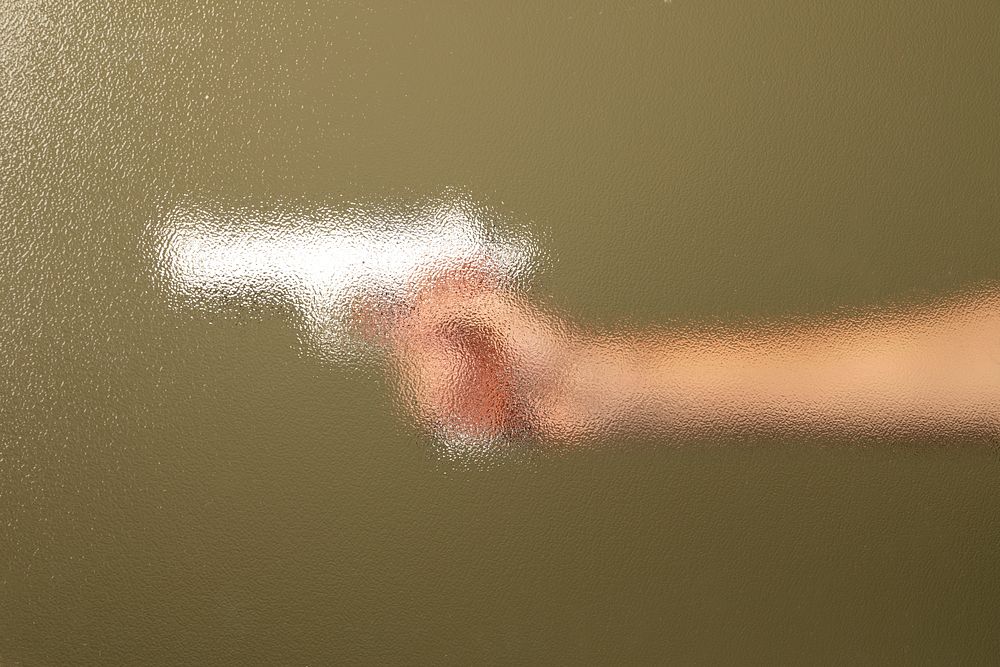 Blurry filter on a hand holding handgun