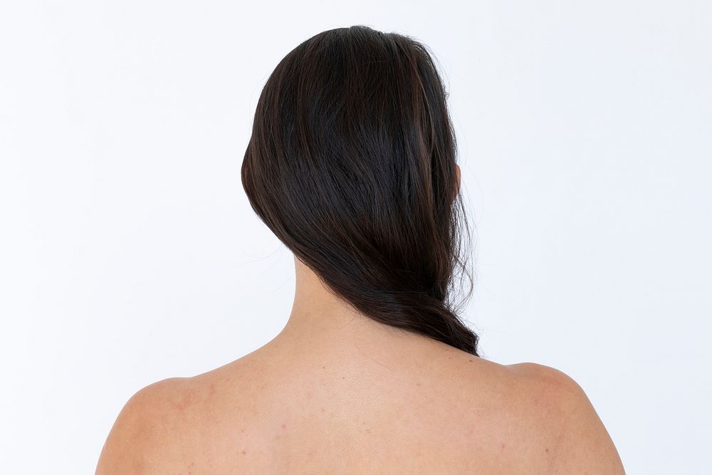 Rear view of a naked woman studio shoot