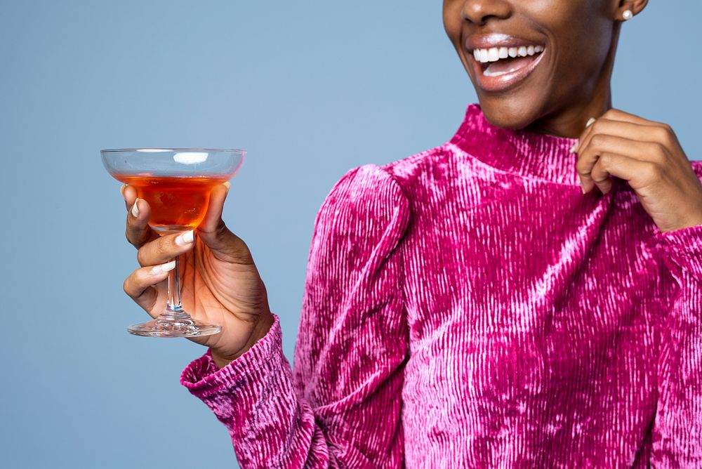 Black woman holding a drink 