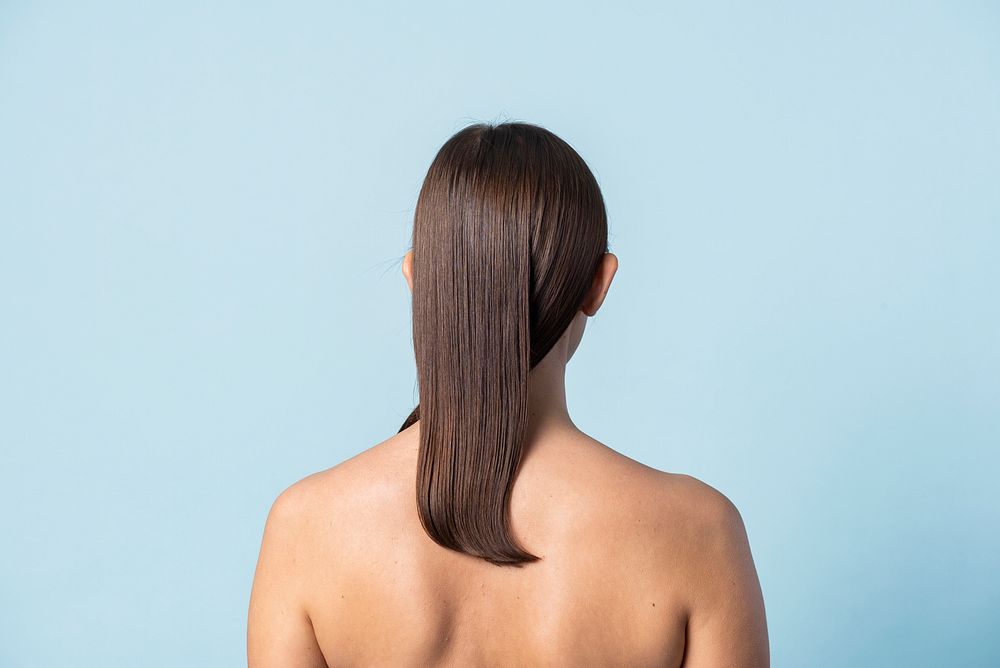 Rear view of a naked woman studio shot