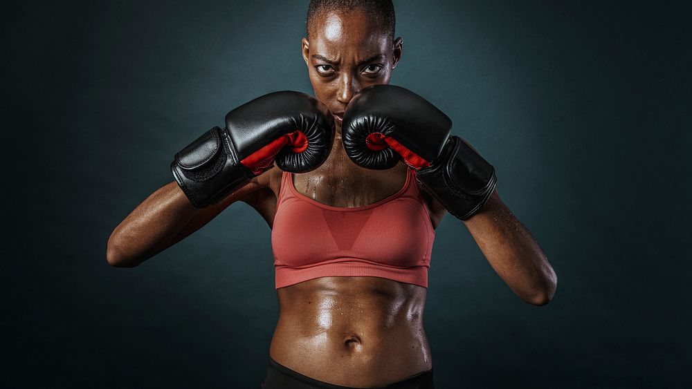 African American female boxer looking strong