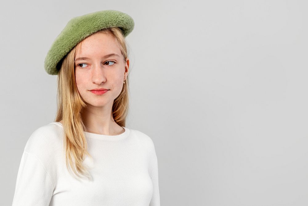 Elegant girl wearing a green beret