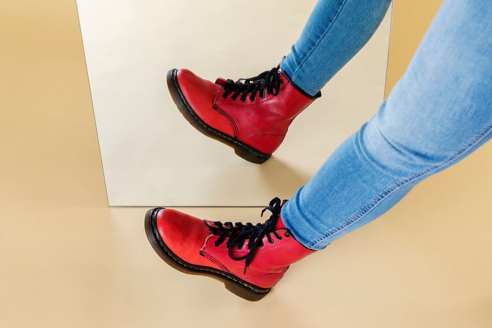 Woman wearing jeans and red combat boots 