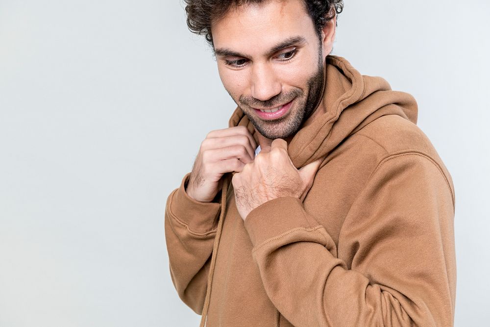 Man in a brown hoodie isolated on white background