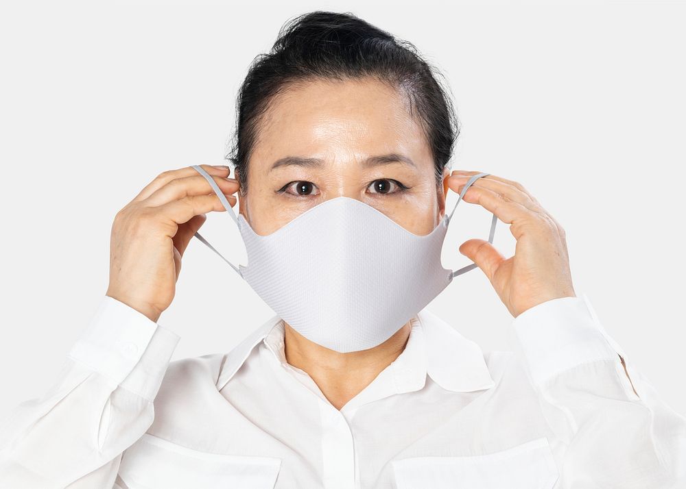 Senior woman wearing white face mask covid-19 campaign with design space
