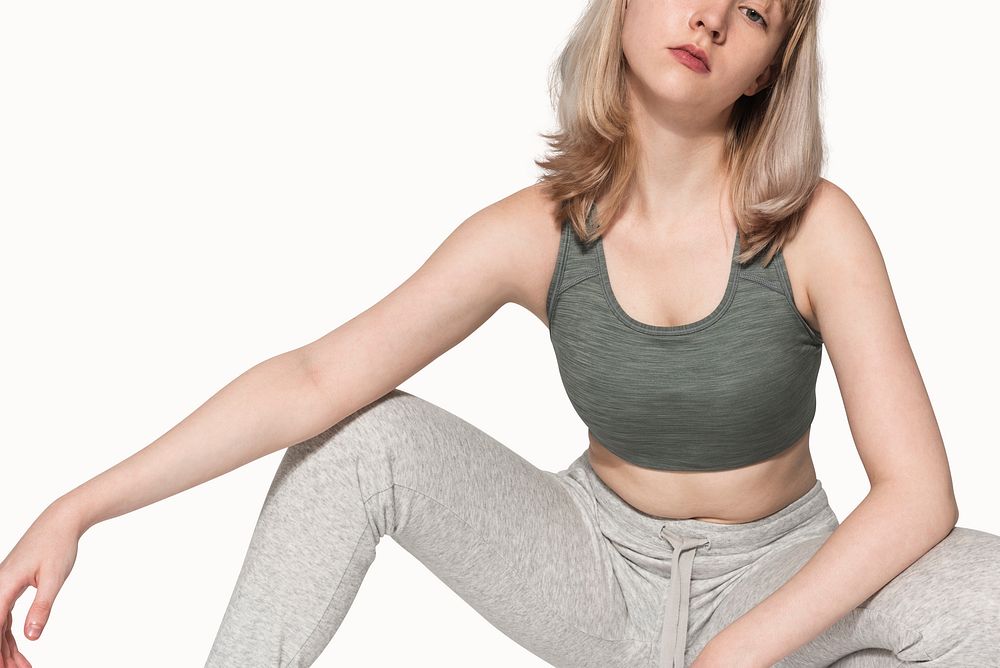 Blonde girl in sports bra and sweatpants activewear photoshoot