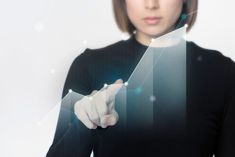 Futuristic digital bar graph presentation by a businesswoman in black shirt 