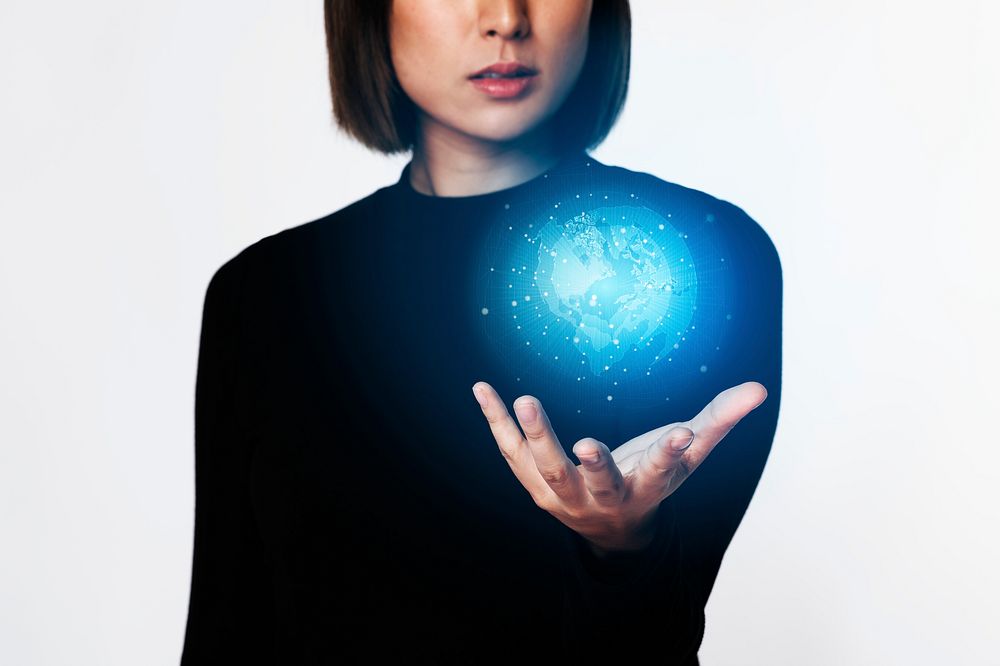 Futuristic digital presentation by an Asian businesswoman