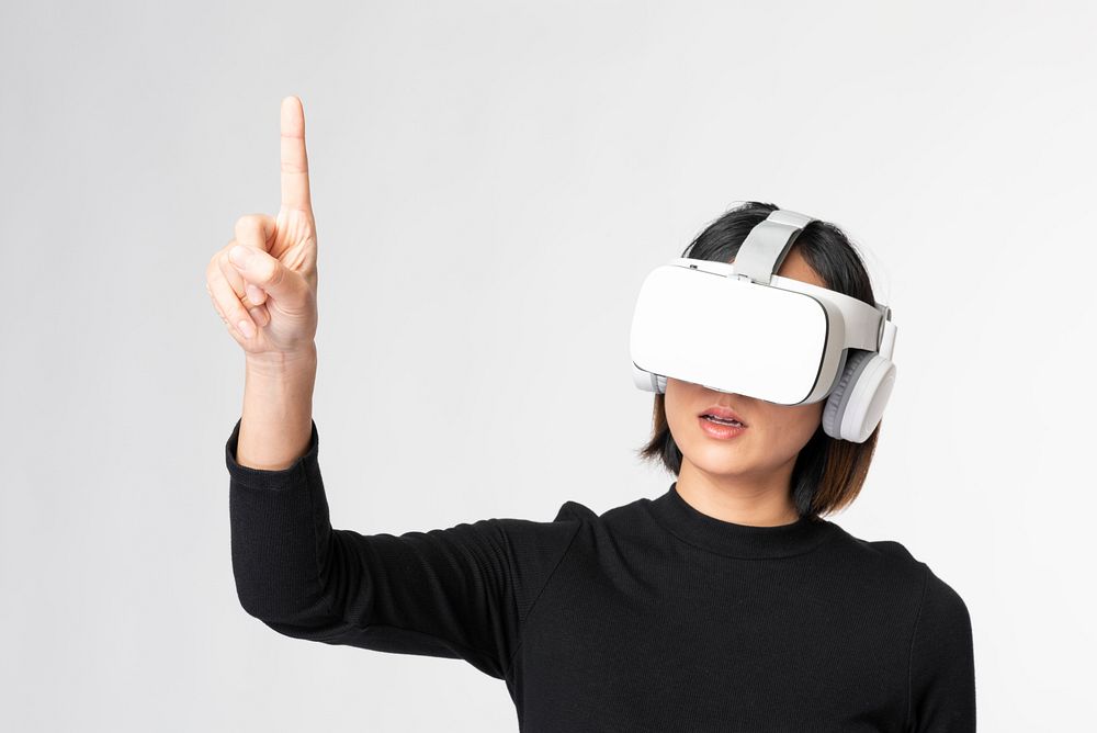 Woman playing a virtual video game on virtual screen