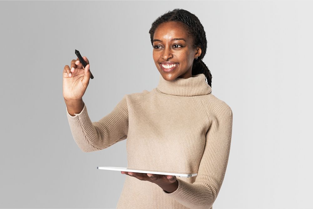 Woman holding a tablet and digital pen