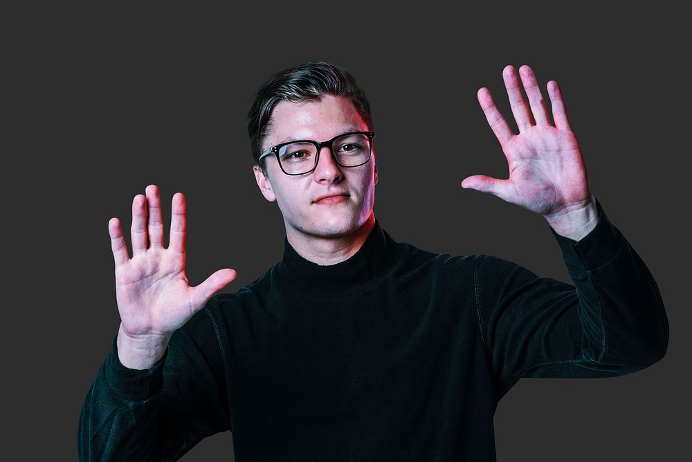 Man touching invisible screen psd with both hands mockup