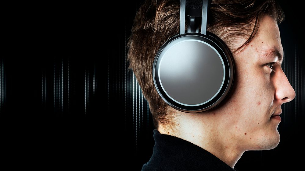 Man listening music with wireless headphones
