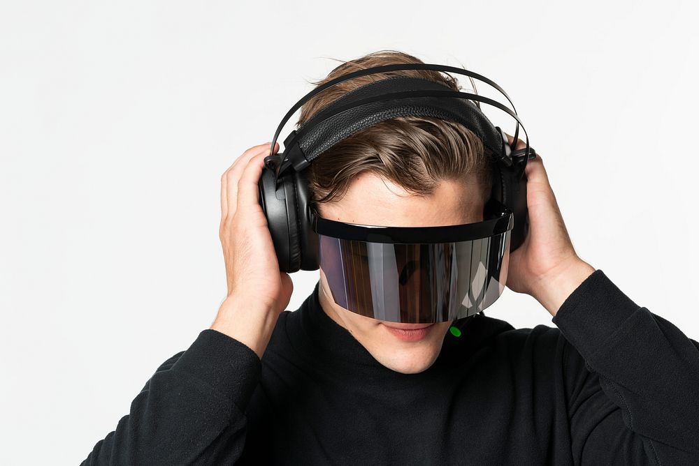 Gamer wearing smart glasses with black headphones