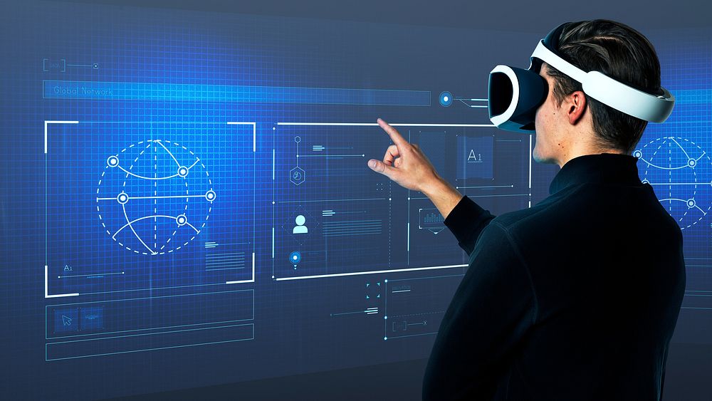 Man wearing VR goggles working on virtual hologram data