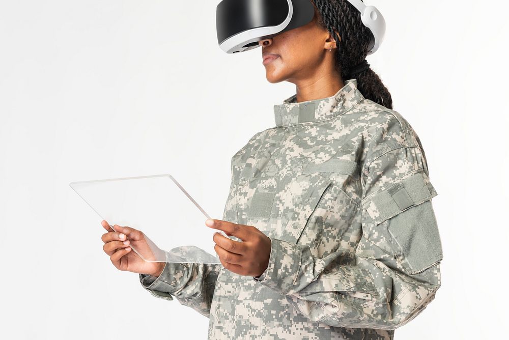 Female military using transparent tablet with VR headset