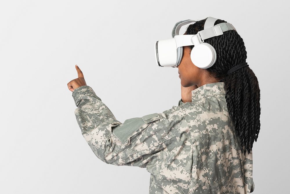 Female soldier wearing VR headset touching invisible screen