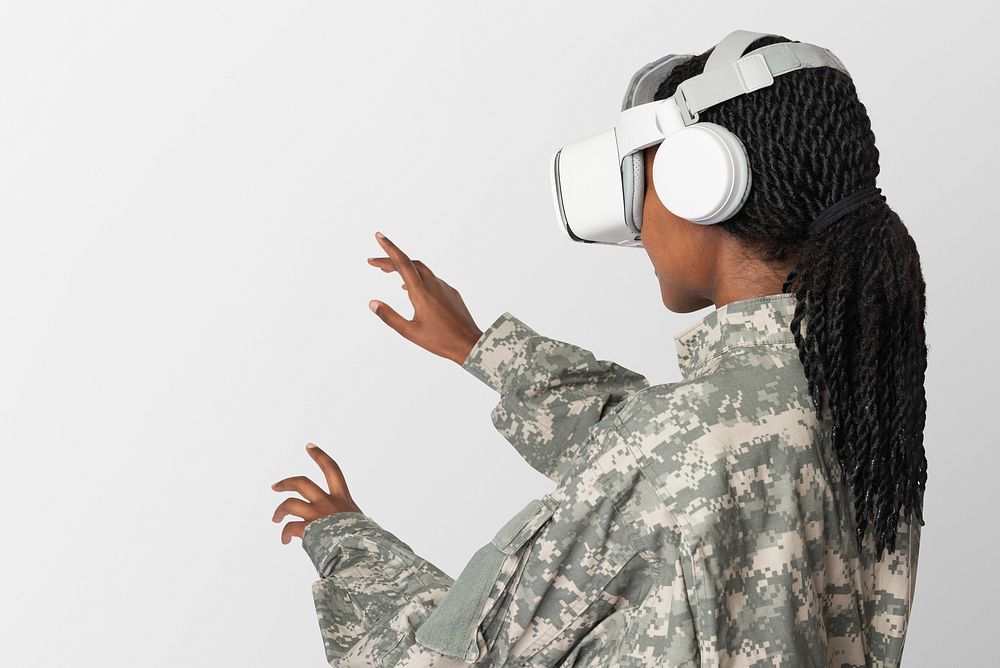 Female military wearing VR headset touching transparent screen