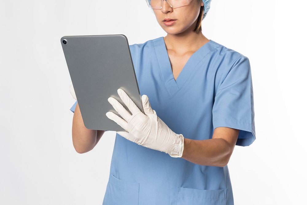 Doctor working on digital tablet
