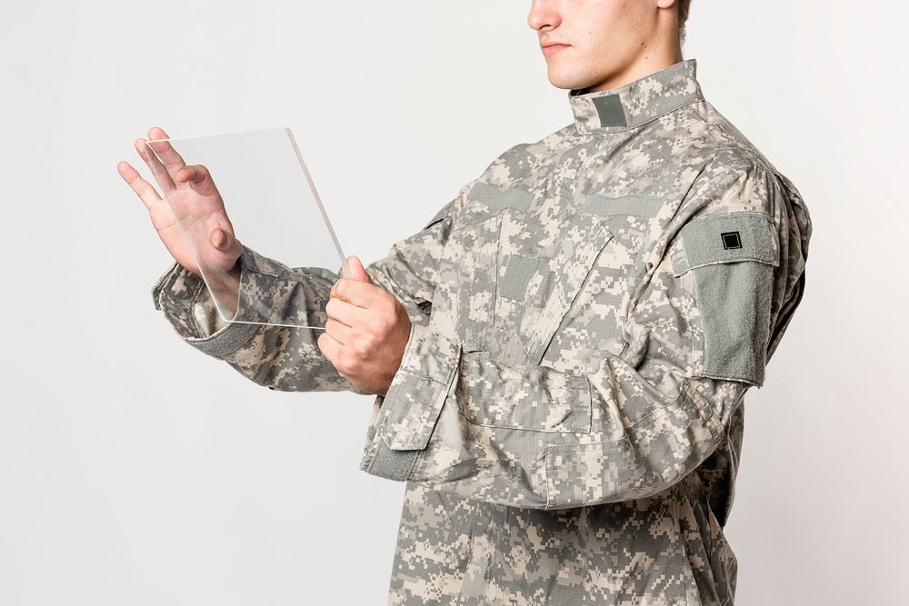 Military man using transparent tablet mockup psd