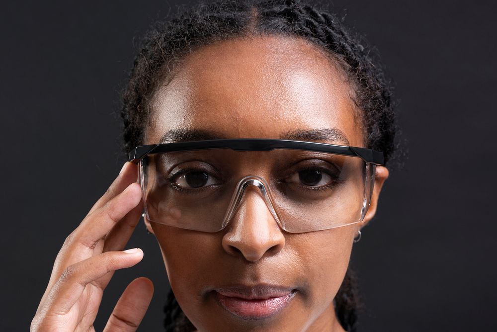 African American woman touching transparent glasses