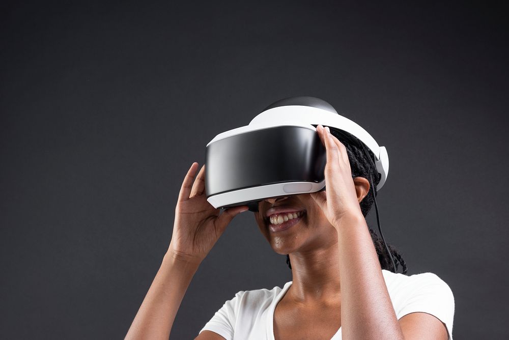 African American woman having virtual reality experience using VR headset