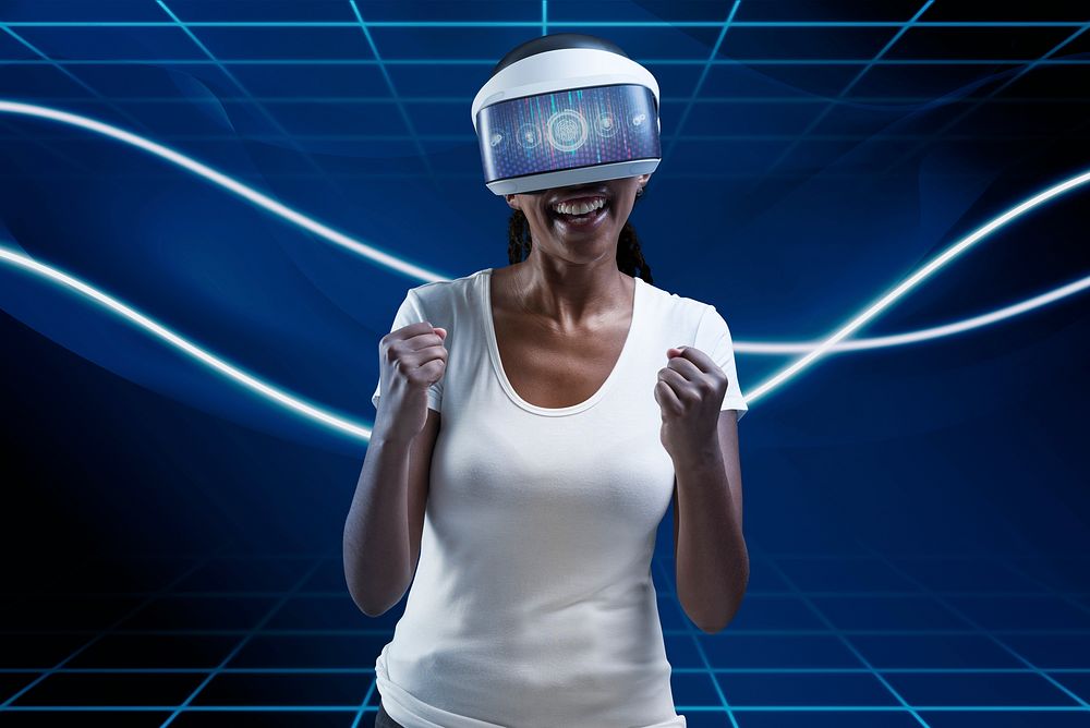 Woman with VR headset cheering with excitement