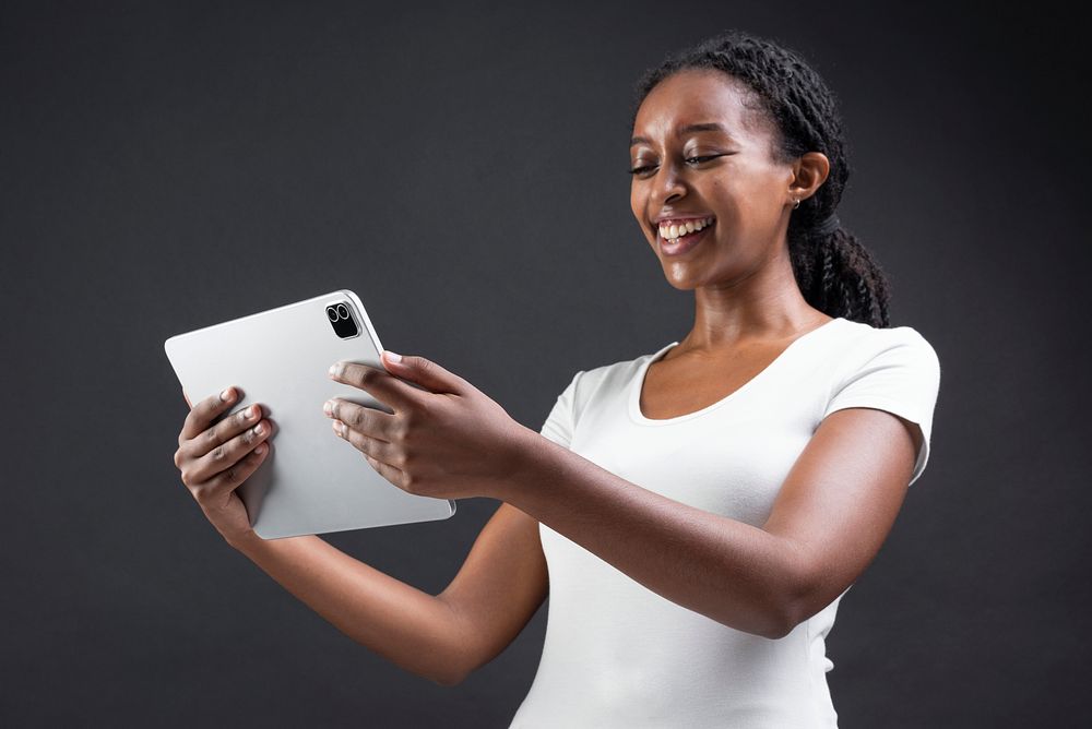 African American woman using digital tablet smart technology