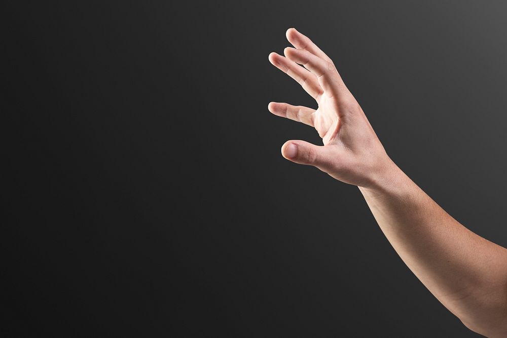Hand reaching out mockup psd on black background