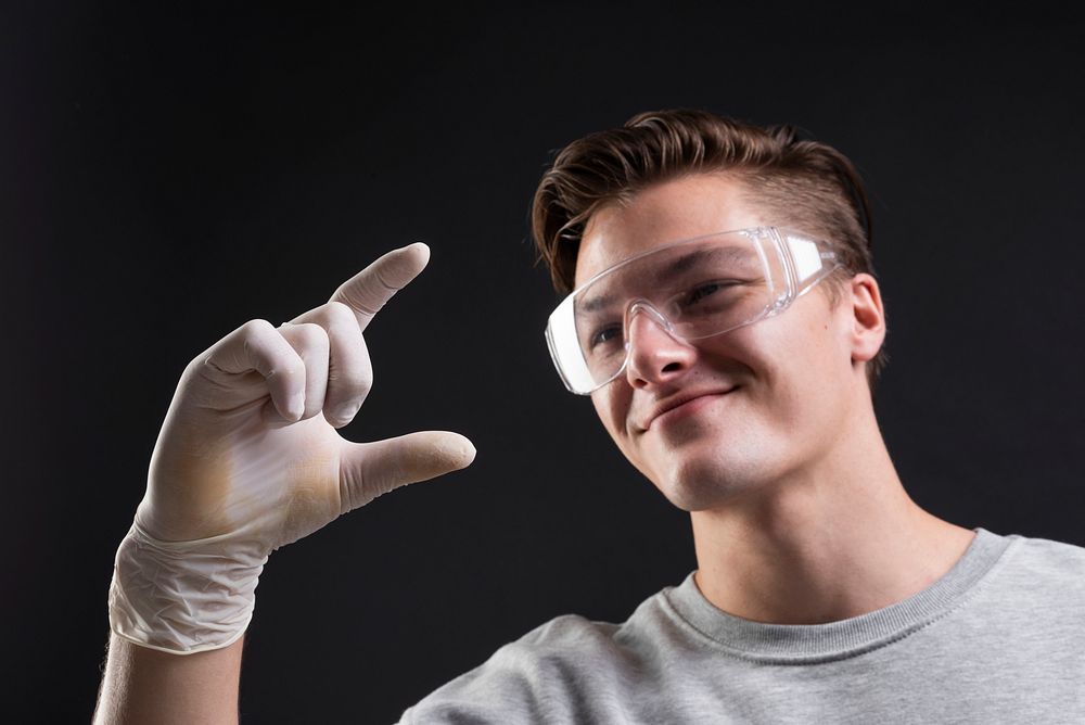 Scientist with hand gesture of discovering something