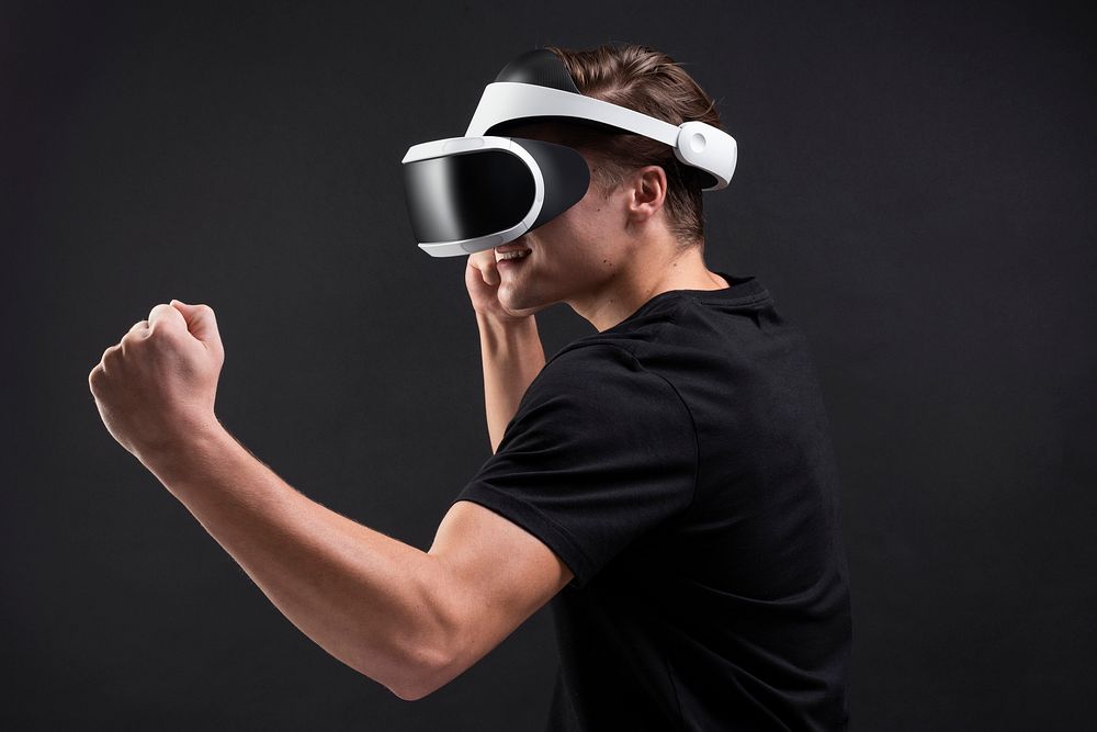 Man with VR headset playing boxing game entertainment technology