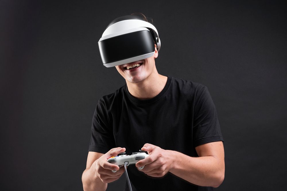Man playing game with VR headset virtual reality experience