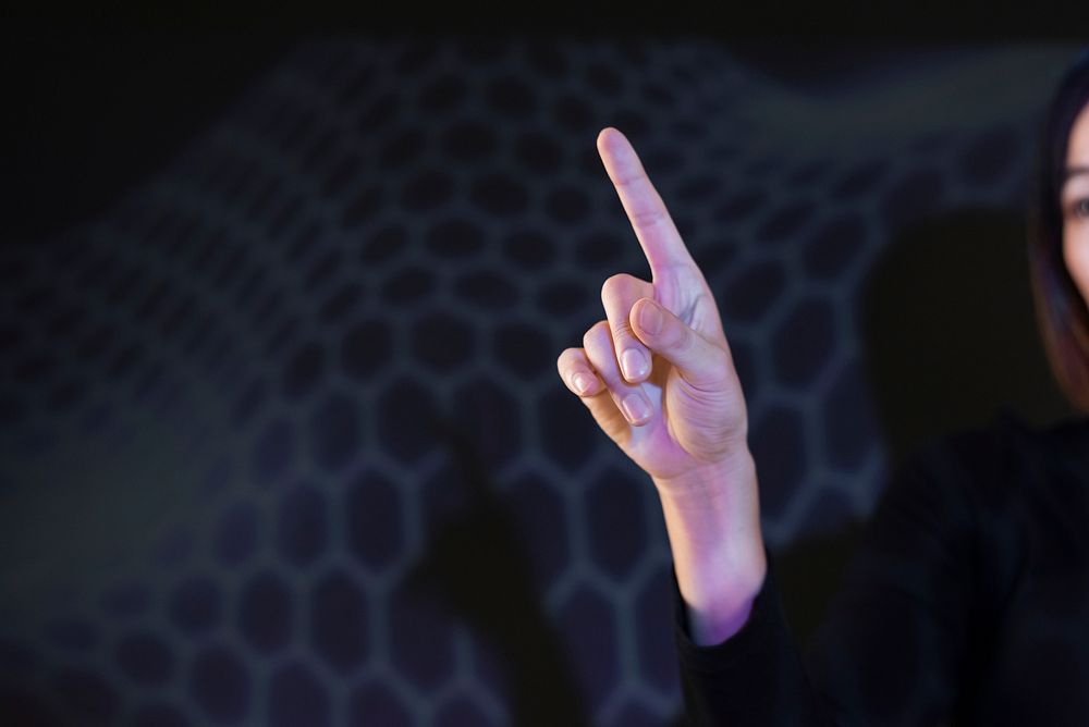 Businesswoman touching virtual screen futuristic