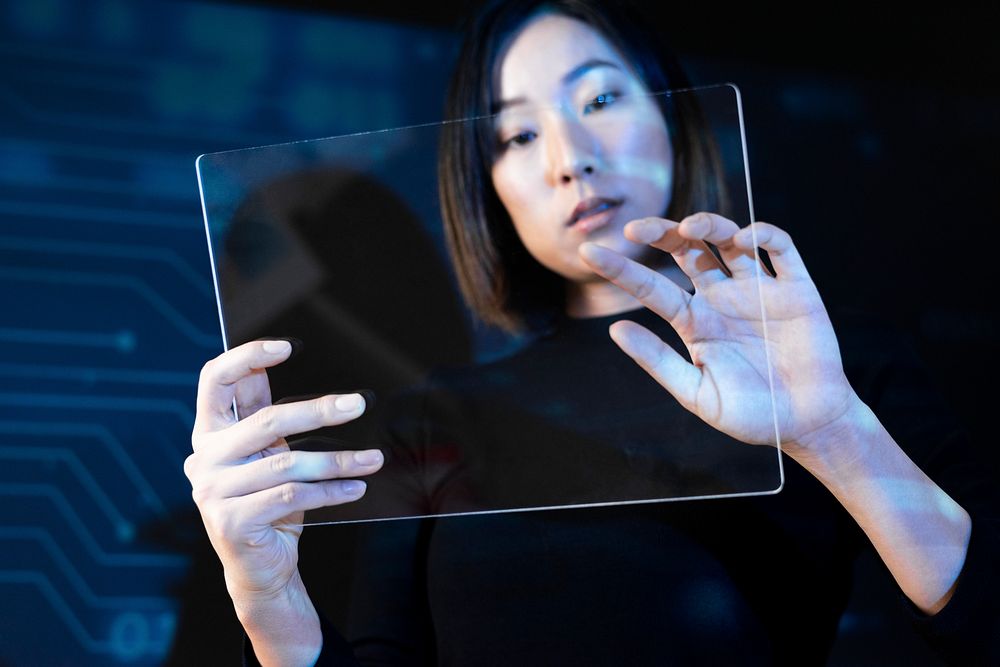 Woman holding psd transparent screen mockup