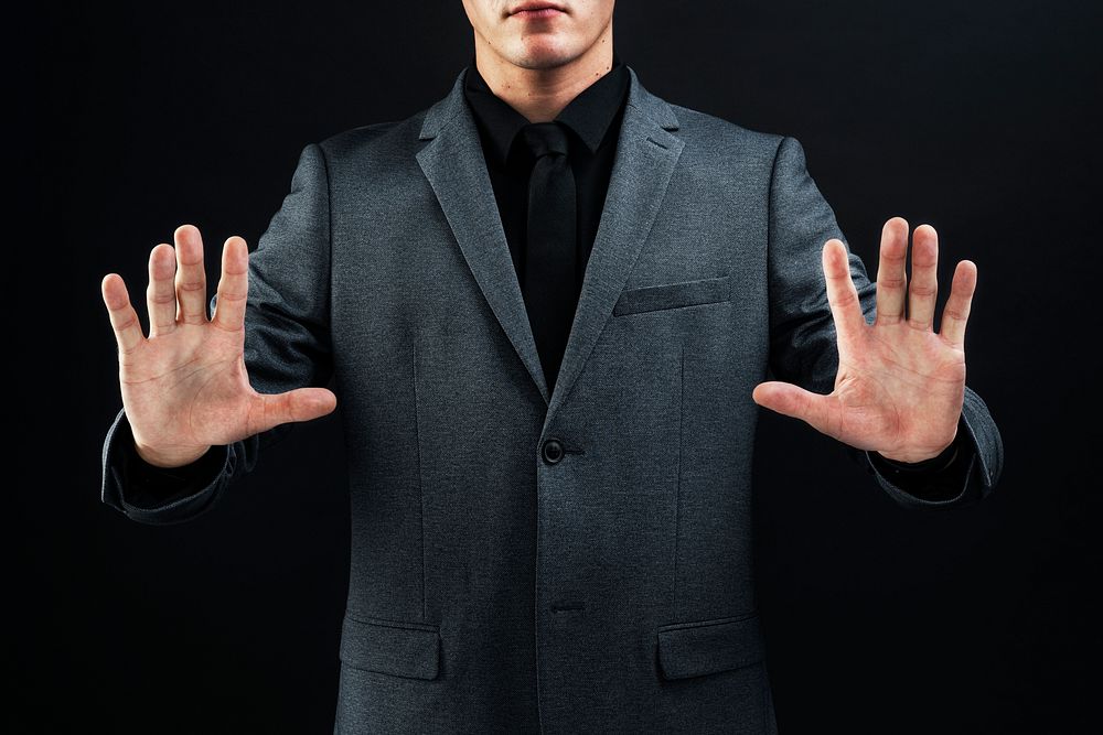 Business man in suit playing with virtual screen technology