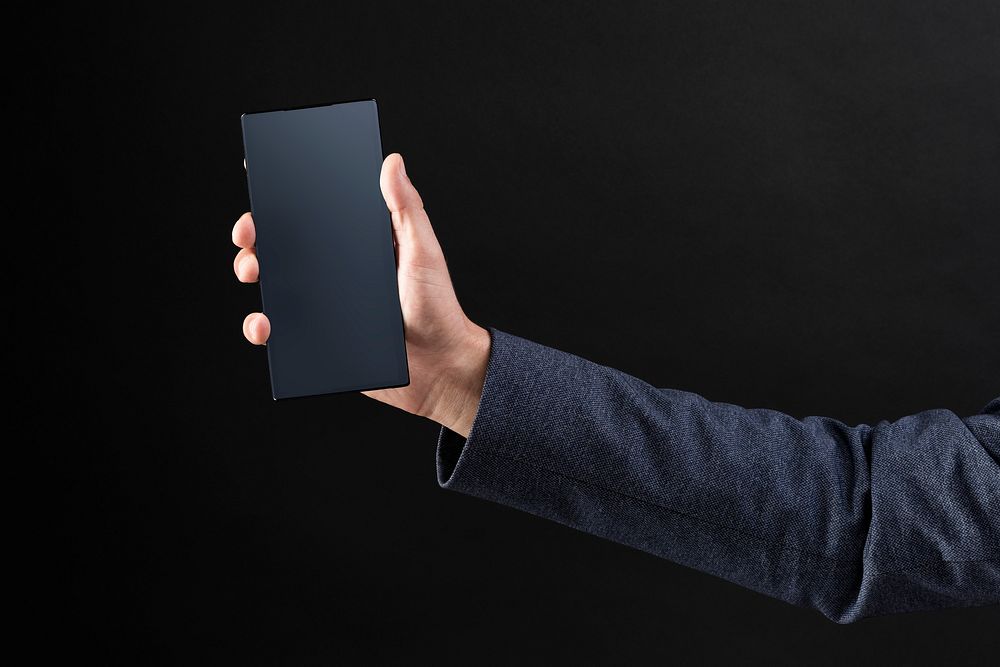 Man holding a smartphone psd screen mockup