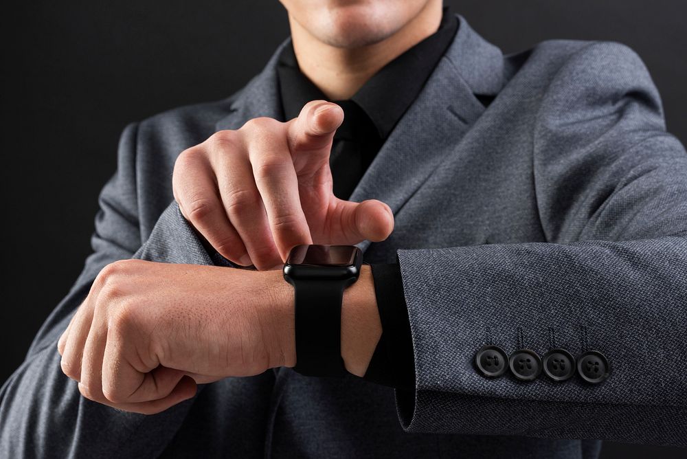 Man touching smartwatch wearable gadget