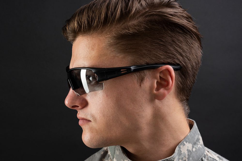 Young military man wearing AR smart glasses